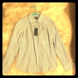 A Tommy Hilfiger Women’s button down shirt. Size s
